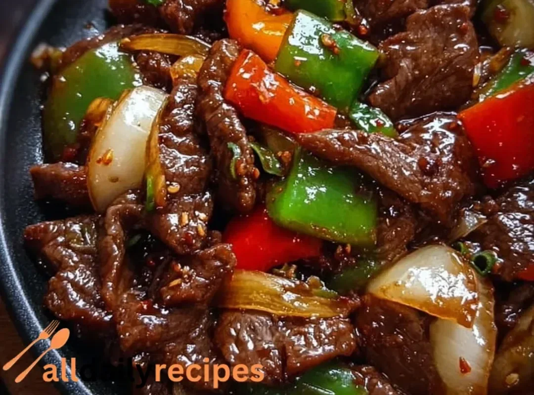 Sizzling Chinese pepper steak with onions served on a plate
