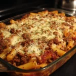 Delicious baked ziti with ground beef and melted cheese in a baking dish