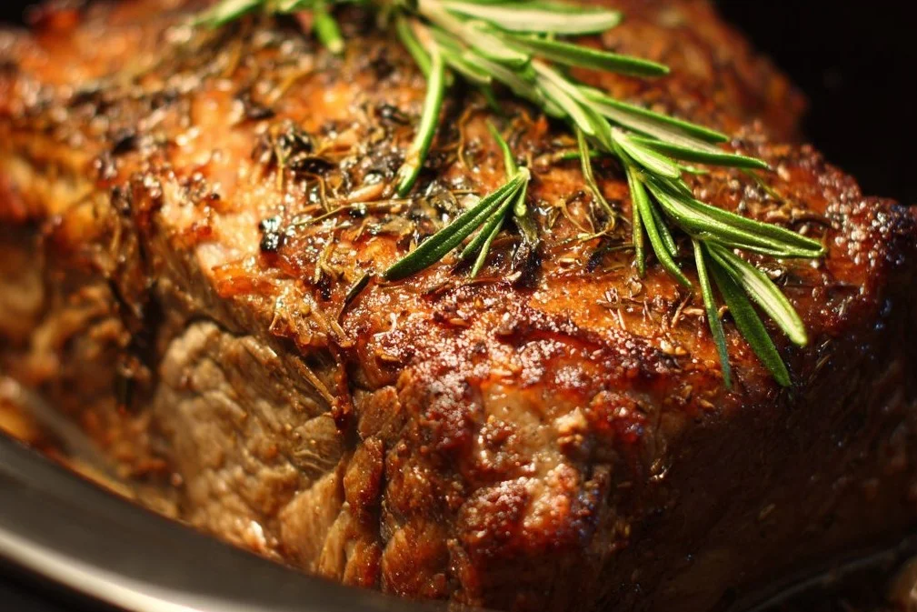 Crockpot beef roast with vegetables and herbs cooked to perfection