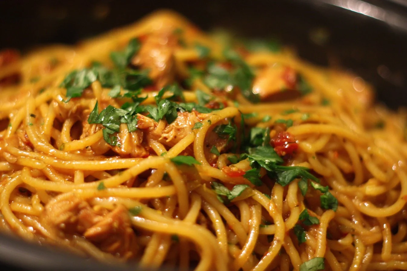 Bowl of delicious Crockpot Chicken Spaghetti with sauce and chicken