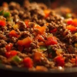 Delicious ground beef dinner served with vegetables and herbs.