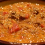 Delicious Rotel Dip with ground beef in a cheesy sauce for dipping