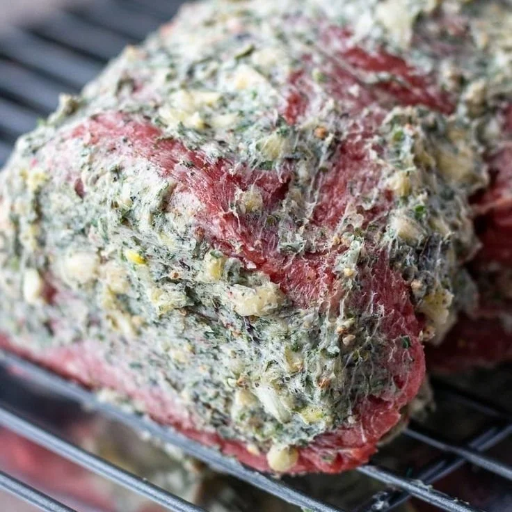 Juicy and perfectly cooked beef tenderloin served on a white plate