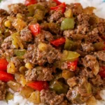 Delicious Beef and Pepper Rice Bowl served in a bowl with colorful vegetables.