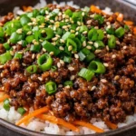 Delicious beef bowls with fresh vegetables and rice.