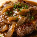 Juicy beef cube steak cooked with herbs and spices on a plate