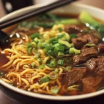 Delicious beef noodles served in a savory broth with herbs and spices