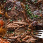 Deliciously cooked beef roast garnished with herbs and spices.