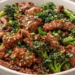 Sizzling beef round steak cooked to perfection on a grill.