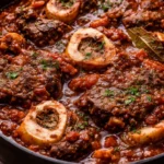 Delicious beef shank braise served with vegetables and herbs