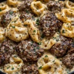 Delicious beef tortellini served with sauce and garnished with parsley