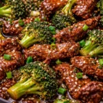 A delicious plate of broccoli beef stir-fry with tender meat and vibrant vegetables.