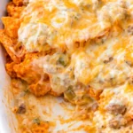Delicious Doritos Casserole with Ground Beef topped with cheese and Doritos chips