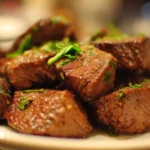 Delicious easy beef recipe served on a plate with vegetables.