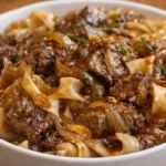 Delicious French onion beef and noodles served in a bowl.