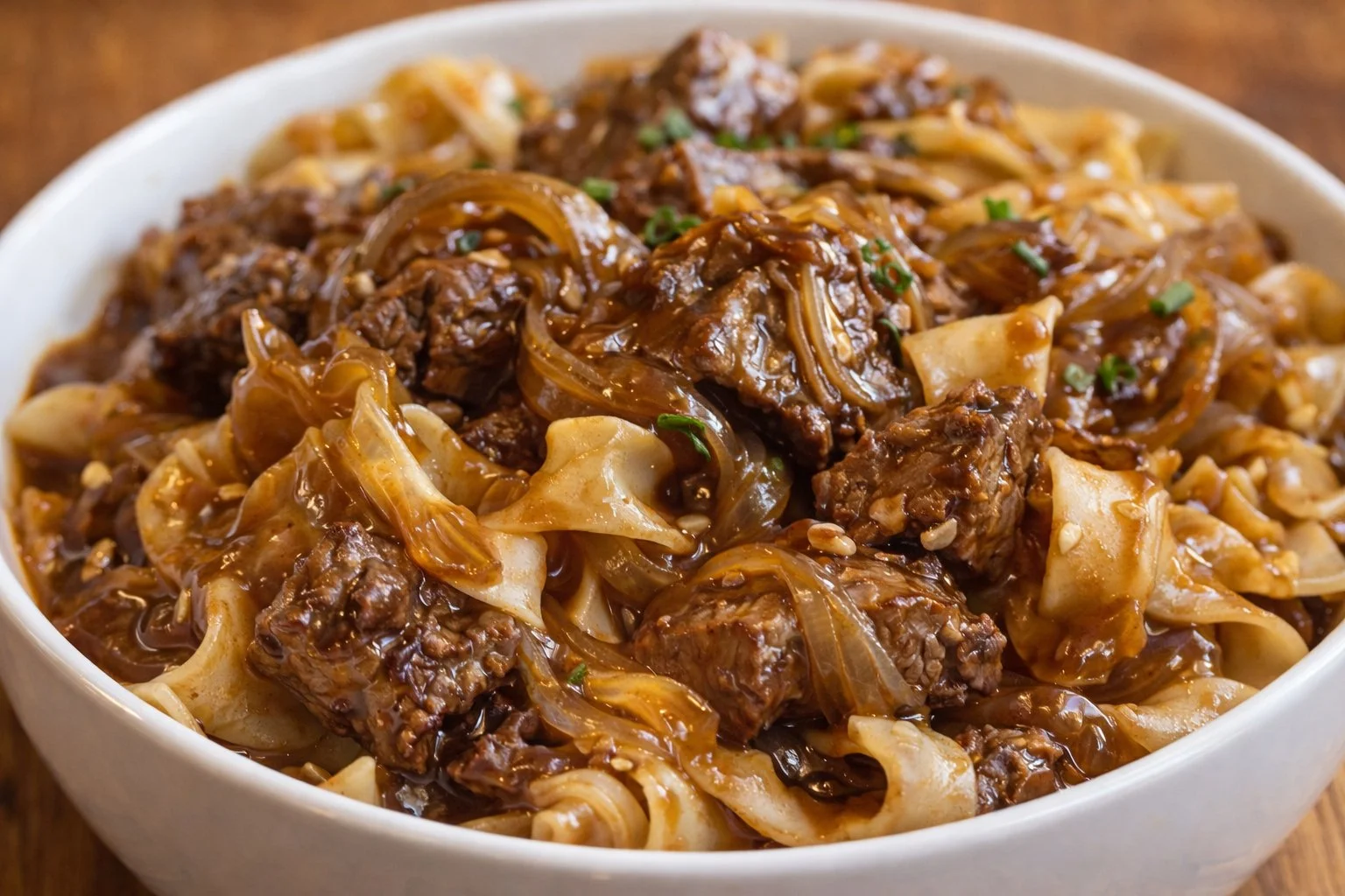 Delicious French onion beef and noodles served in a bowl.