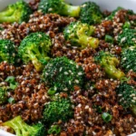 Ground beef and broccoli stir-fry served on a plate with vibrant vegetables.