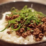 Delicious Korean ground beef served with rice and vegetables.