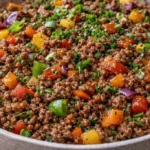 Mediterranean ground beef stir fry with fresh vegetables and herbs