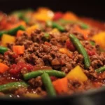 A plate of delicious minced beef recipe garnished with herbs and spices.