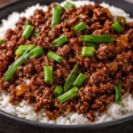 Plate of Mongolian Ground Beef served with vegetables and rice