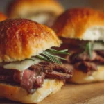 Delicious roast beef sliders served on a platter with garnishes.
