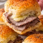 Roast beef sliders served on Hawaiian rolls with toppings.
