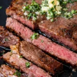 Succulent Wagyu Beef steak with exquisite marbling on a wooden platter.