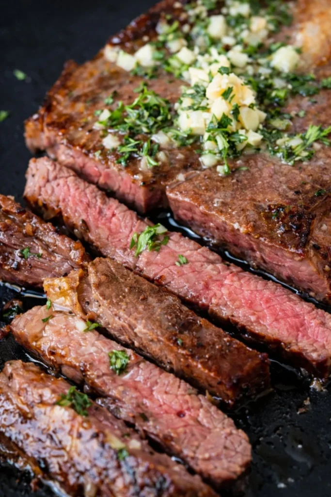 Succulent Wagyu Beef steak with exquisite marbling on a wooden platter.