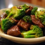 Beef Broccoli dish with tender meat and fresh broccoli in a savory sauce.