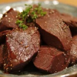 Cooked beef heart dish garnished and ready to serve