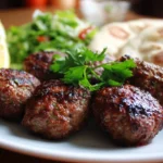 Delicious Beef Kofta meatballs served with sauces and garnishes.