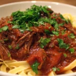 Delicious Beef Ragu served over pasta with rich sauce