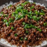 Delicious beef rice bowl with tender beef, vegetables, and savory sauce