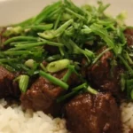 Delicious beef stew cooking in a pot with vegetables and spices