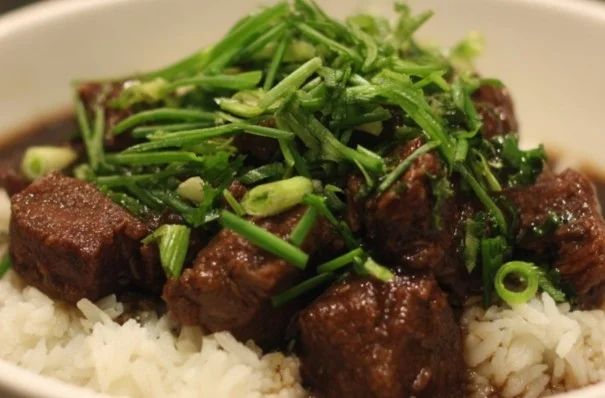 Delicious beef stew cooking in a pot with vegetables and spices