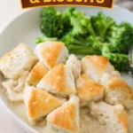 Plate of chicken and biscuits, a delicious comfort food dish.