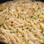 Delicious Chicken and Noodles prepared in a crockpot for a comforting meal.