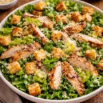 Delicious Chicken Caesar Salad with grilled chicken, romaine lettuce, and Parmesan cheese
