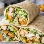 Delicious Chicken Caesar Wrap with grilled chicken, lettuce, and Caesar dressing