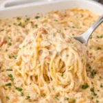 Delicious Chicken Spaghetti Casserole baked dish with melted cheese and herbs