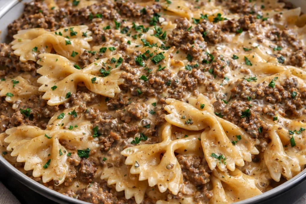 Creamy Parmesan Garlic Beef Pasta with bowtie noodles in a rich sauce