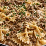 Creamy Parmesan Garlic Beef Pasta with bowtie noodles in a rich sauce