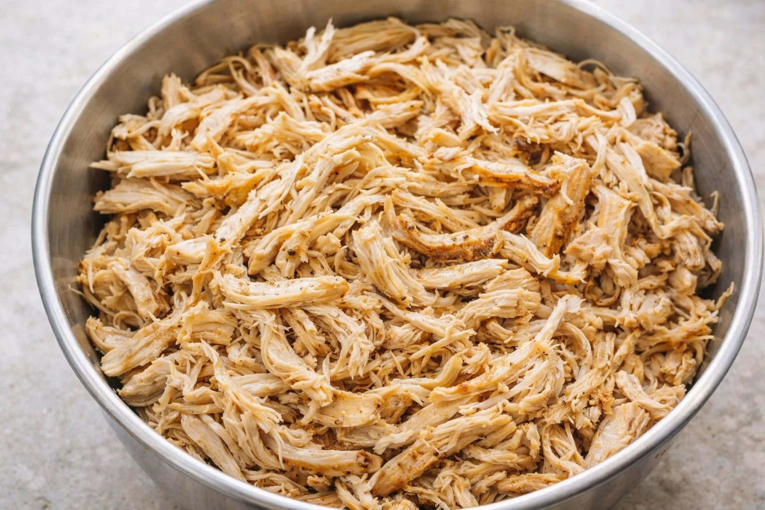 Crockpot dish featuring tender shredded chicken ready to serve