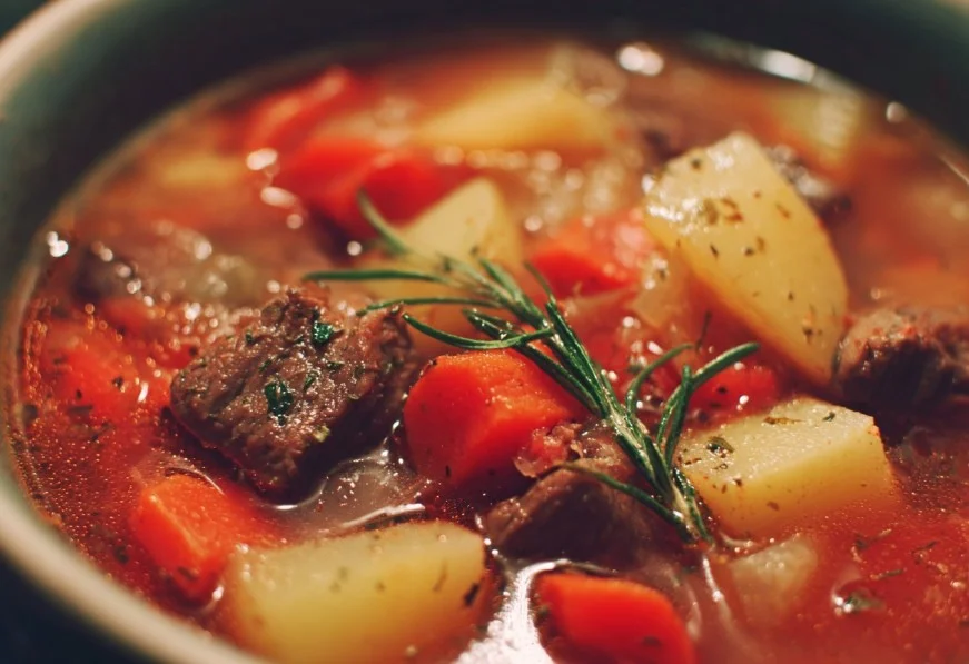 Bowl of delicious Crockpot Vegetable Beef Soup with fresh vegetables and chunks of beef