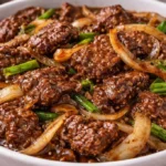 Diced beef stir-fry with colorful vegetables in a skillet