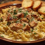 Delicious plate of easy Chicken Alfredo pasta with creamy sauce and chicken pieces.