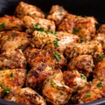 Delicious Garlic Chicken served on a plate with herbs and spices.