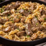Healthy beef stroganoff served with mushrooms and creamy sauce over noodles