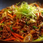Paleo ground beef stir-fry with colorful vegetables in a skillet